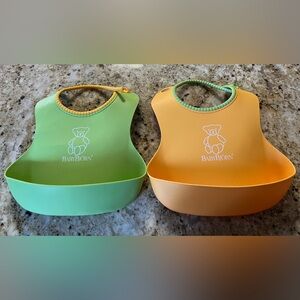 BabyBjörn two waterproof baby bibs, yellow and green